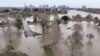 A view of flooding from the rainstorm-swollen Sacramento and American Rivers, near downtown Sacramento, California, Jan. 11, 2023. 