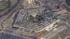 FILE - The Pentagon is seen from Air Force One as it flies over Washington, March 2, 2022. 