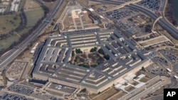 FILE - The Pentagon is seen from Air Force One as it flies over Washington, March 2, 2022. 