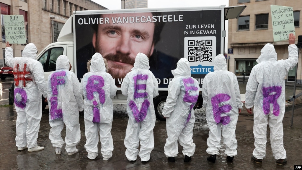 Protesters wear clothes reading 'Free Olivier' during a solidarity demonstration calling for the release from Iranian custody of Belgian aid worker Olivier Vandecasteele, in Brussels, Belgium, Dec. 25, 2022. 