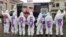 Protesters wear clothes reading 'Free Olivier' during a solidarity demonstration calling for the release from Iranian custody of Belgian aid worker Olivier Vandecasteele, in Brussels, Belgium, Dec. 25, 2022. 