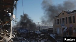 Plumes of smoke rise from a Russian strike during a 36-hour cease-fire over Orthodox Christmas declared by Russian President Vladimir Putin, in the eastern front line city of Bakhmut, Ukraine, Jan. 7, 2023.