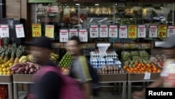 FILE - Food prices are displayed at a market in Rio de Janeiro, Brazil April 8, 2022. 