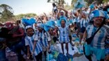 Argentina fans in Buenos Aires celebrate after Argentina's Lionel Messi scores their first goal in a World Cup seminfinal match between Croatia and Argentina in Qatar, Dec. 13, 2022.
