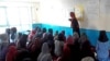 Girls barred from education by Taliban study in a secret school run by volunteers in Afghanistan. (Photo courtesy Parasto)