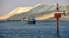 FILE - An Egyptian navy craft patrols the Suez Canal on March 30, 2021. 