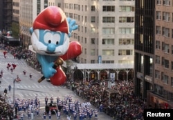 Papa Smurf flies over the crowd during the 96th Macy's Thanksgiving Day Parade in , New York City, Nov. 24, 2022.