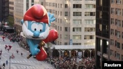 Papa Smurf flies over the crowd during the 96th Macy's Thanksgiving Day Parade in New York, Nov. 24, 2022.
