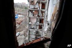 A view of an apartment building, damaged during heavy fighting, in Mariupol, in the Russian-controlled Donetsk region, eastern Ukraine, Jan. 5, 2023.