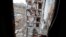 A view of an apartment building, damaged during a heavy fighting, in Mariupol, in Russian-controlled Donetsk region, eastern Ukraine, Jan. 5, 2023. 