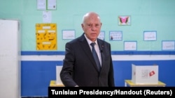 FILE - Tunisia's President Kais Saied casts his ballot at a polling station, during a referendum on a new constitution, in Tunis, July 25, 2022.