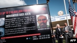 A poster displays the $10 million reward offered by the U.S. for information on terror suspect Mohamoud Abdi Aden of the 2019 Dusit D2 hotel complex attack in Nairobi, at the DCI headquarters in Nairobi, Jan. 12, 2023. 