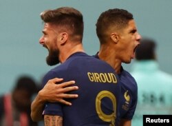 France's Olivier Giroud celebrates scoring their second goal with Raphael Varane at Al Bayt Stadium, Al Khor, Qatar on December 10, 2022.