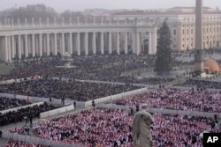 Faithful attend the funeral mass for late Pope Emeritus Benedict XVI in St. Peter's Square at the Vatican, Jan. 5, 2023. (AP Photo/Ben Curtis)