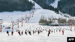 This photo taken on Dec. 5, 2022 shows people skiing at a ski area after it reopened in Urumqi, in China's northwestern Xinjiang region, following the easing of COVID-19 restrictions in the city.