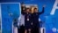 Lionel Messi holds out the trophy during the team's arrival in Buenos Aires, Dec. 20, 2022, after after winning the World Cup.