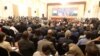 Attendees sit at the ceremony to sign the framework agreement between military rulers and civilian power in Khartoum, Sudan, Dec. 5, 2022. 