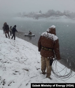 Power technicians work in remote areas of Uzbekistan as the snow comes down, Dec. 5, 2022. (Source: Uzbek Ministry of Energy)