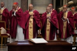 Cardinals and bishops pray during the funeral ceremony of Australian Cardinal George Pell in St. Peter's Basilica at the Vatican, Jan. 14, 2023.