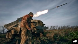 A Ukrainian rocket launcher fires at Russian positions near Bakhmut, Donetsk region, Ukraine, Nov. 24, 2022.