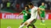 FILE— Voria Ghafouri, right, then an Iranian national soccer team player, fights for the ball during the AFC Asian Cup soccer match at the Al Maktoum Stadium in Dubai, United Arab Emirates, Jan. 16, 2019. 