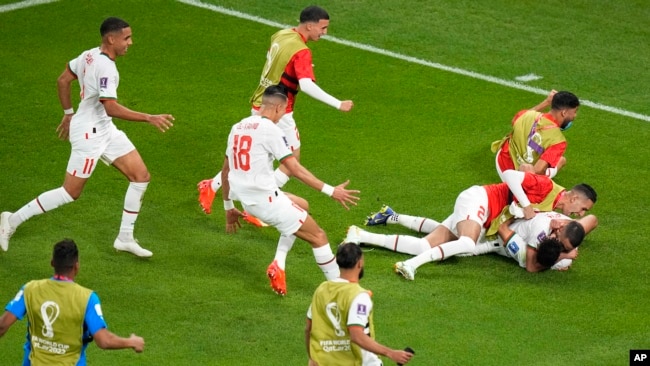 Morocco's Zakaria Aboukhlal celebrates with his teammates after scoring his side's second goal during the World Cup group F soccer match between Belgium and Morocco, at the Al Thumama Stadium in Doha, Qatar, Nov. 27, 2022.