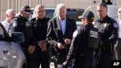 U.S. Customs and Border Protection officers show President Joe Biden a portable X-ray device as he tours El Paso port of entry, Bridge of the Americas, a busy port of entry along the U.S.-Mexico border, in El Paso Texas, Jan. 8, 2023. 