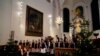 Shchedryk youth choir members leave the stage, following a Christmas concert at Copenhagen’s Church of the Holy Spirit, in Copenhagen, Denmark, Thursday, Dec. 8 2022.