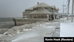 Hoak's restaurant is covered in ice from the spray of Lake Erie waves during a winter storm that hit the Buffalo region in Hamburg, New York, Dec. 24, 2022.