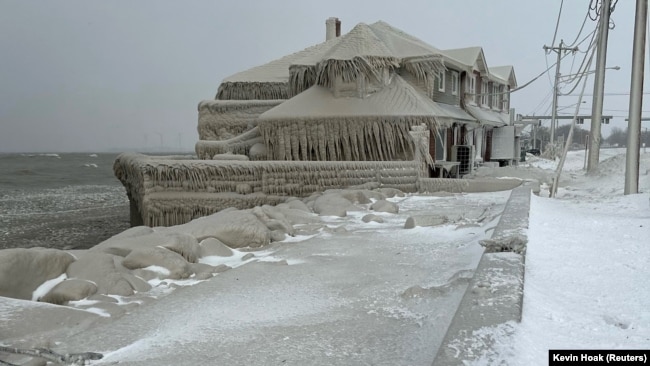 Hoak's restaurant is covered in ice from the spray of Lake Erie waves during a winter storm that hit the Buffalo region in Hamburg, New York, Dec. 24, 2022.
