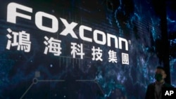 FILE - The Foxconn logo is seen during the Hon Hai Tech Day in Taipei, Taiwan, on Oct. 18, 2022.