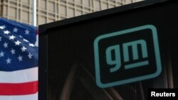 FILE - The new GM logo is seen on the facade of the General Motors headquarters in Detroit, Michigan, March 16, 2021.