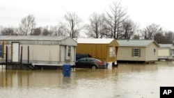 A mobile home community in Ruleville, Miss., is flooded from rain that accompanied storms that ripped across the U.S., Dec. 14, 2022.