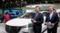 FILE - Chinese Ambassador to the US Qin Gang (left) at the North American International Auto Show in Detroit, Michigan, Sept. 14, 2022.
