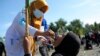 A medical worker gives drops of vaccine to a girl during a polio immunization campaign at Sigli Town Square in Pidie, Aceh province, Indonesia, Nov. 28, 2022. 