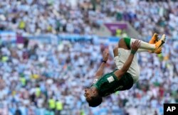 Saudi Arabia's Salem Al-Dawsari celebrates after scoring his side's second goal during the World Cup group C soccer match between Argentina and Saudi Arabia at the Lusail Stadium in Lusail, Qatar, Nov. 22, 2022.