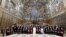 Pope Francis poses for pictures on the day of his "State of the World" address to diplomats, at the Vatican, Jan. 9, 2023. (Vatican Media/­Handout via Reuters) 