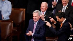 U.S. Rep. Kevin McCarthy, R-Calif., smiles after winning the 15th vote in the House chamber as the House enters the fifth day trying to elect a speaker and convene the 118th Congress in Washington, Jan. 7, 2023.