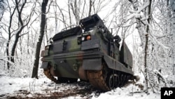 Ukrainian MLRS Multiple Launch Rocket System takes a position at the front line at an undisclosed location in the Donetsk region, Ukraine, Nov. 24, 2022.