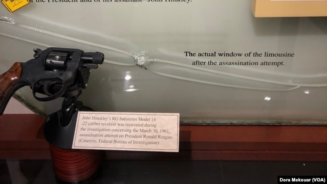Window from the armored limousine that was struck by a bullet during the 1981 assassination attempt on President Ronald Reagan and the revolver used by would-be assassin John Hinckley .