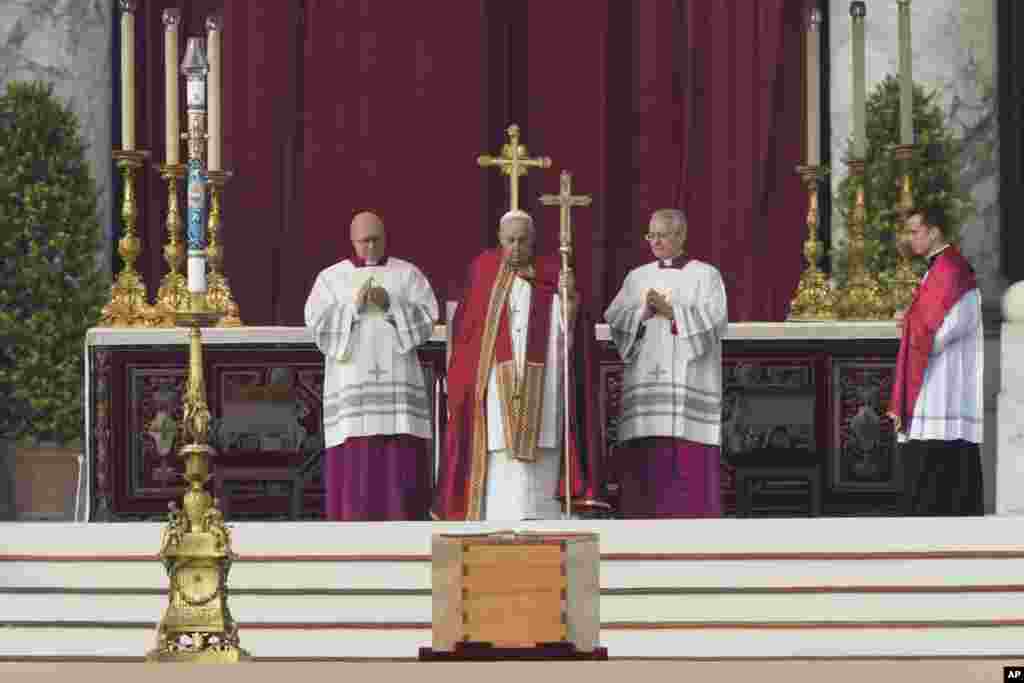 Pope Francis, center, presides over the funeral of late Pope Benedict XVI in St. Peter&#39;s Square at the Vatican, Jan. 5, 2023.