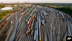 FILE - Freight train cars sit in a Norfolk Southern rail yard in Atlanta, Sept. 14, 2022.