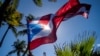 Bendera Puerto Rico tampak berkibar diterpa angin di San Juan, Puerto Rico, pada 9 Februari 2022. (Foto: Reuters/Ricardo Arduengo)