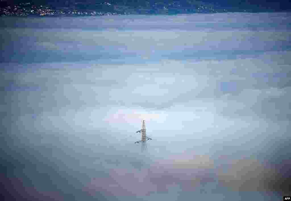 Skopje&#39;s valley is seen surrounded by fog in Skopje, North Macedonia.