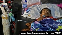 Azka Maulana Malik, 5, was rescued after being trapped for two days under the rubble of his house in Nagrak Village, Cianjur, Indonesia, Nov. 23, 2022.