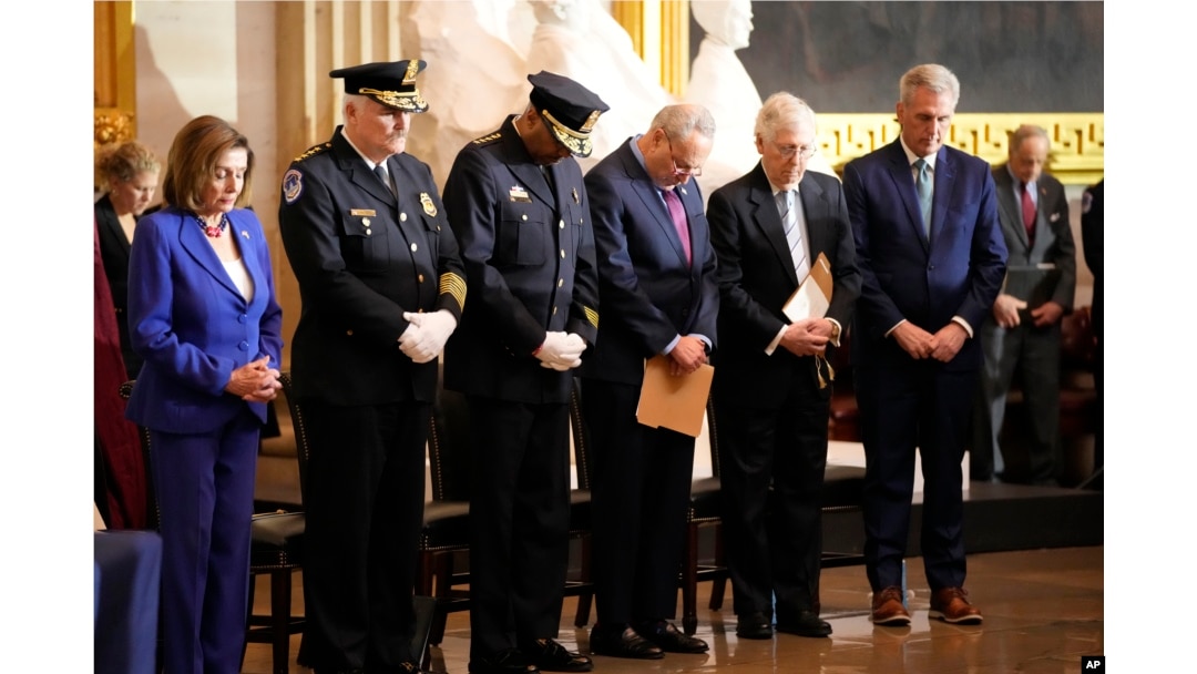 From left, Speaker of the House Nancy Pelosi of Calif., U.S. Capitol Police Chief J. Thomas Manger, Washington D.C. Metropolitan Police Chief Robert J. Contee, Senate Minority Leader Mitch McConnell of Ky., and House Minority Leader Kevin McCarthy of Calif., pray during a Congressional Gold Medal ceremony honoring law enforcement officers who defended the U.S. Capitol on Jan. 6, 2021, in the U.S. Capitol Rotunda in Washington, Tuesday, Dec. 6, 2022.