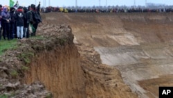 People protest the demolition of a village to make way for the expansion of a mine in Germany, Jan. 14, 2023.