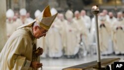 Cardinal Angelo De Donatis celebrates Mass for the health of Pope Emeritus Benedict XVI inside the St. John at the Lateran Basilica in Rome, Dec. 30, 2022.