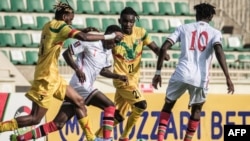 Kenya's Boniface Muchiri (2nd L) vies for the ball with Mali's Adama Traore (2nd R) during the FIFA World Cup 2022 qualifier football match between Kenya and Mali at Nyayo national stadium in Nairobi on October 10, 2021.