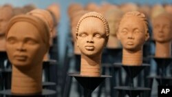 Sculptures created by French artist Prune Nourry representing the approximately 100 Chibok schoolgirls still in captivity are displayed in Lagos, Nigeria, Dec. 13, 2022. 